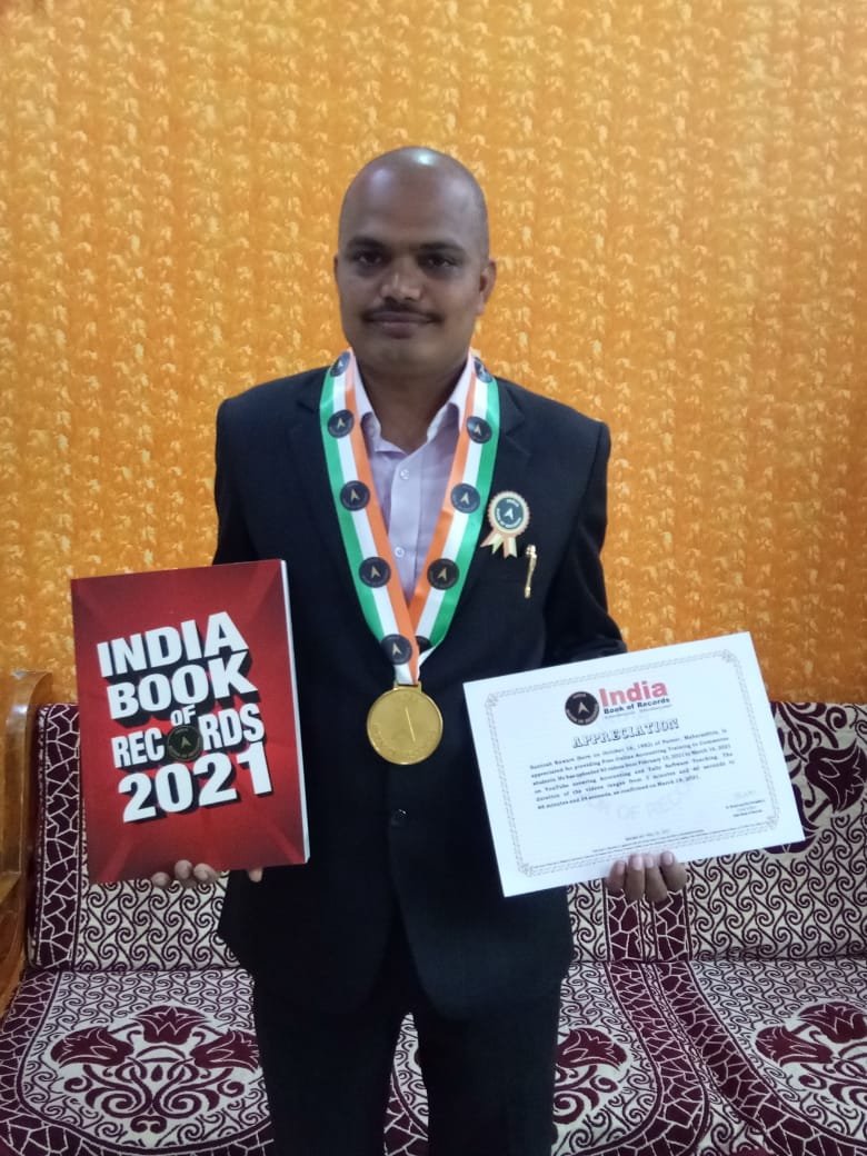 Santoshh Kaware standing next to a car